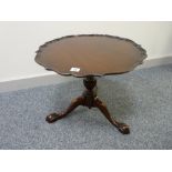 A QUALITY REPRODUCTION PIECRUST TOP SIDE TABLE on an urn shaped column and swept leg base with