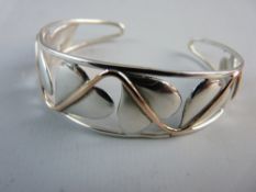 A CLOGAU WELSH GOLD AND SILVER VINE LEAF CUFF BANGLE, hallmarked Clogau and 925 silver