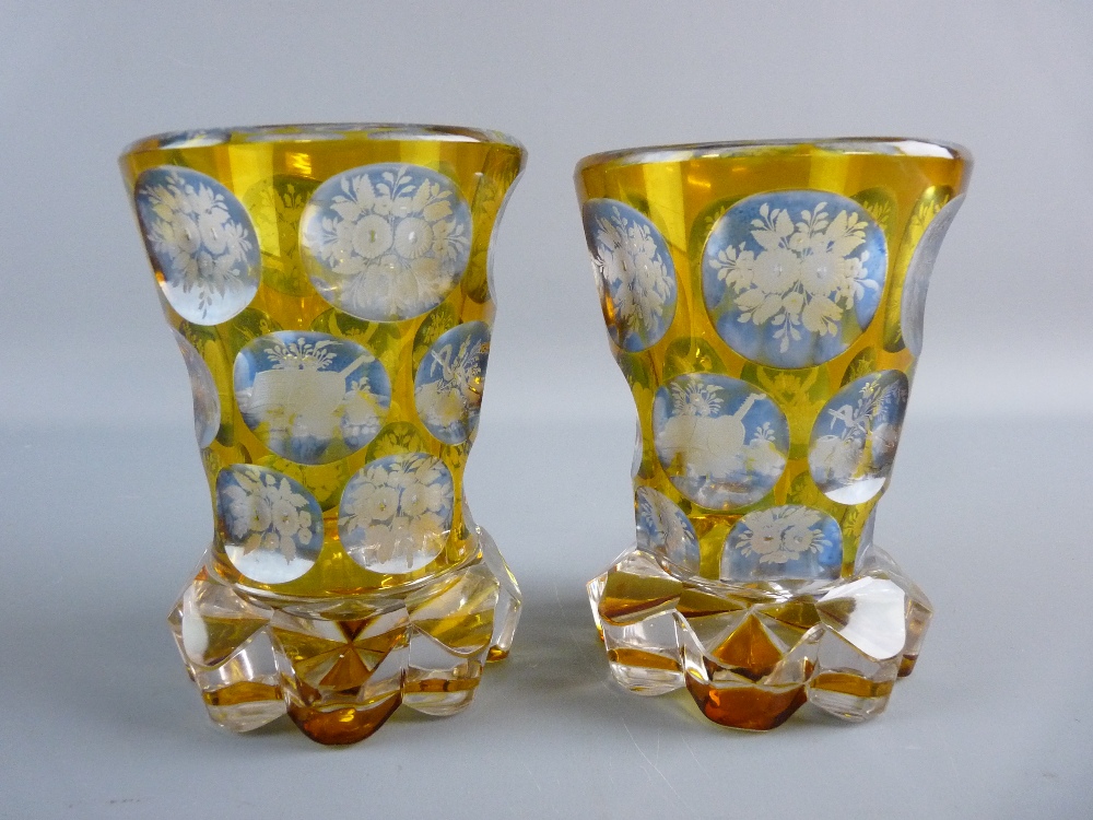 A PAIR OF LATE 19th CENTURY BOHEMIAN GLASS VASES, amber to clear with continuous bands of faceted
