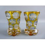 A PAIR OF LATE 19th CENTURY BOHEMIAN GLASS VASES, amber to clear with continuous bands of faceted