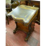 A 19th CENTURY INLAID WALNUT DAVENPORT having a shaped tooled leather skiver to the sloping top,