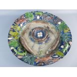 A LARGE BERNARD PALISSY STYLE DEEP DISH CHARGER, 49 cms diameter with profuse fish, reptile and