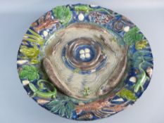 A LARGE BERNARD PALISSY STYLE DEEP DISH CHARGER, 49 cms diameter with profuse fish, reptile and