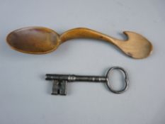 A WELSH TREEN SYCAMORE CAWL SPOON, 20.5 cms long and an antique cast iron key, 11.5 cms long