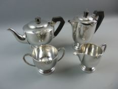 A FOUR PIECE HALLMARKED SILVER TEASET comprising tea and coffee pot with bakelite style handles