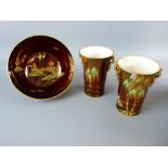 THREE PIECES OF CARLTONWARE ROUGE ROYALE to include a pair of stork pattern ribbed vases with gilt