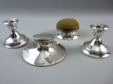 A PAIR OF SILVER SQUAT CANDLESTICKS, a capstan inkwell (no pot) and a lidded pin cushion box in