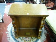 A VICTORIAN OAK PRAYER STAND with carved and shaped lower decoration and brass memorial plaque dated