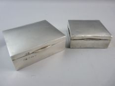 TWO HALLMARKED SILVER CIGARETTE BOXES, 8.5 cms wide, Birmingham 1928 (monogram to top with