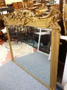 A VICTORIAN GILT DECORATED OVERMANTEL MIRROR with top central cartouche and opposing leaf and floral
