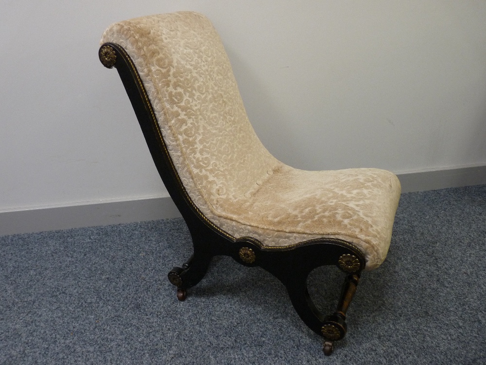 A VICTORIAN EBONIZED EMPIRE STYLE BEDROOM CHAIR in embossed pattern upholstery with gilt metal