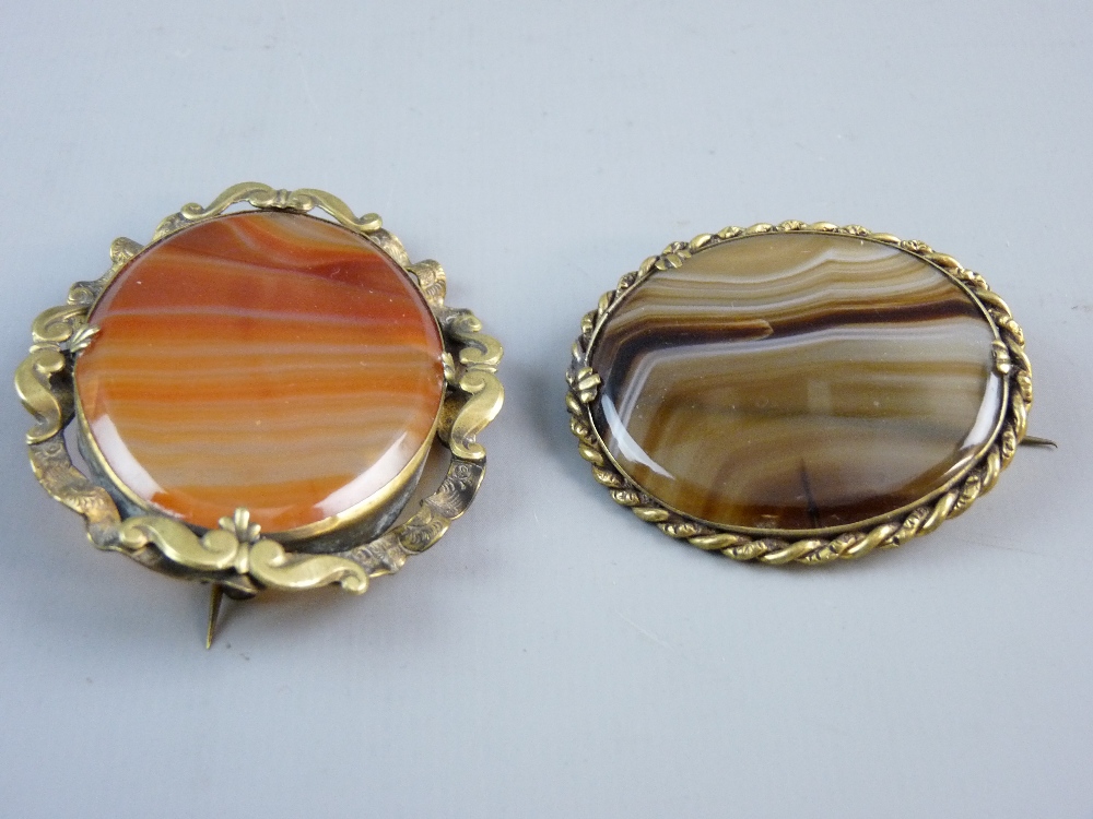 TWO LARGE OVAL YELLOW METAL FRAMED AGATE BROOCHES