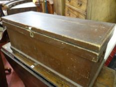 AN ANTIQUE PINE CAPTAIN'S CHEST, rectangular form with interior candle box, iron lock and carry