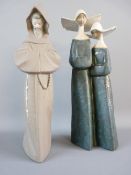A LLADRO FIGURAL GROUP of two nuns, finished in satin glazes and a matt glazed figure of a hooded