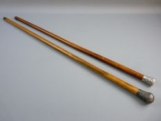 TWO MALACCA WALKING CANES with decorative Indian silver tops, 82 and 88 cms long