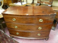 A GEORGIAN MAHOGANY THREE DRAWER BOW FRONTED CHEST, the cock beaded drawers with stag decorated oval