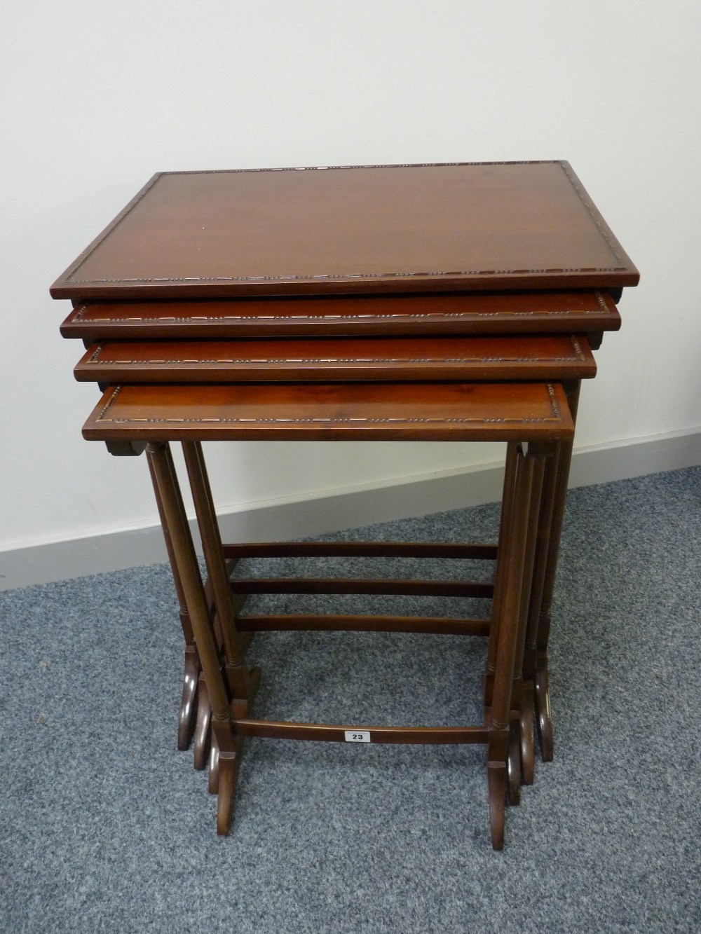 A GOOD QUARTETTO OF EDWARDIAN MAHOGANY SIDE TABLES with beaded edge top decoration on turned slender