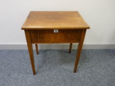 AN OAK WORK TABLE, the lidded top opening to reveal a satin lined interior on square tapering