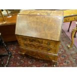 A 20th CENTURY WALNUT FALL FRONT BUREAU, the slope opening to reveal a tooled leather writing