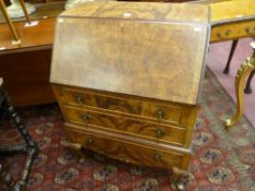 A 20th CENTURY WALNUT FALL FRONT BUREAU, the slope opening to reveal a tooled leather writing