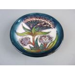 A BOXED MOORCROFT GYPSY PIN DISH, 11.5 cms diameter, impressed and written marks to the base,