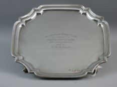 A HALLMARKED SILVER CARD TRAY, Sheffield 1935 with shaped wavy edge standing on four feet, 20 troy