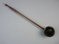 A 19th CENTURY TREEN TODY LADLE with turned handle and bowl, 41 cms long