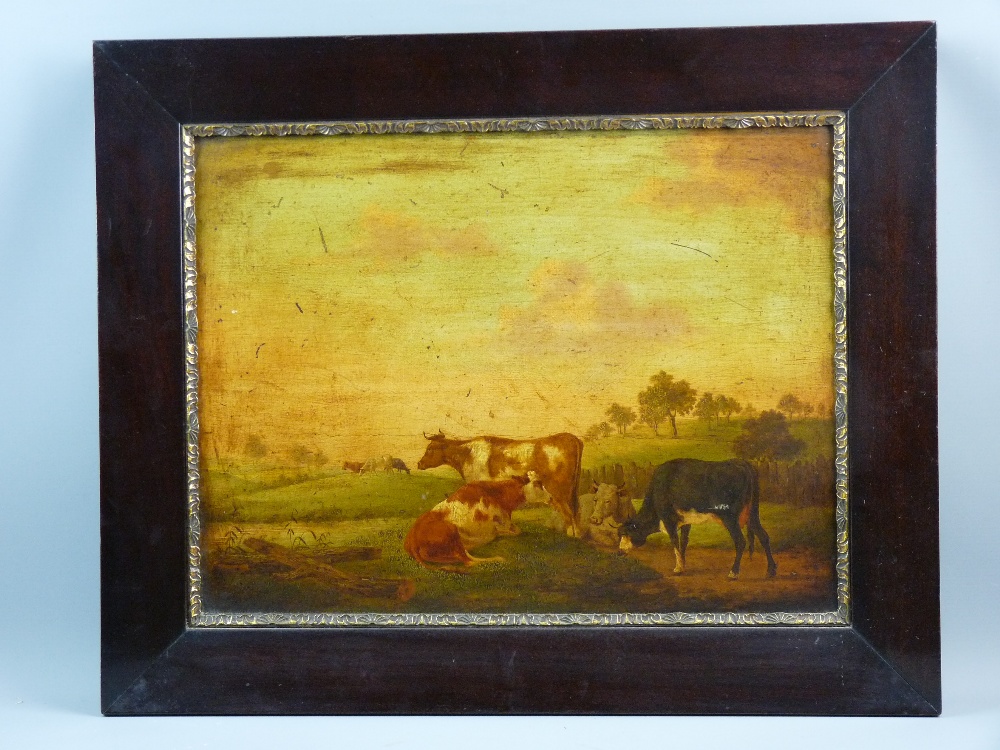 19th CENTURY ENGLISH SCHOOL oil on panel - four resting cattle on a hillock with three further