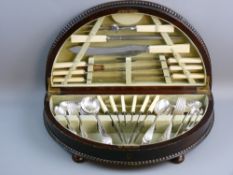 AN OAK CASED CANTEEN OF CUTLERY, demi-lune with beadwork decoration and turned bun feet with
