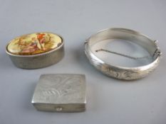 A HALLMARKED SILVER BANGLE and two pill boxes, the bangle with bright cut decoration, marked