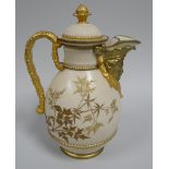 A ROYAL WORCESTER BLUSH LIDDED JUG having a mask head spout, faux bamboo handle and basket weave