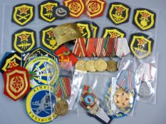 NINE RUSSIAN MILITARY MEDALS and other memorabilia to include Forces Insignia patches, a brass