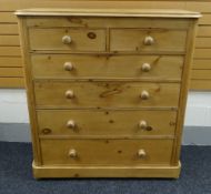 A GOOD TALL VICTORIAN PINE CHEST-OF-DRAWERS having four graduated long drawers and two upper short