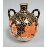 A DERBY PORCELAIN GLOBULAR VASE having a narrow neck and twin handles, decorated in the Imari