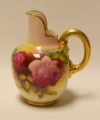 A SMALL ROYAL WORCESTER JUG with gilded handle and upright spout, painted with roses by Millie Hunt,