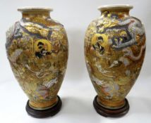 A PAIR OF SATSUMA THOUSAND FACES BALUSTER VASES typically decorated and with applied circling