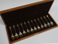 A CASED SET OF TWELVE RSPB COMMEMORATIVE SILVER SPOONS each with a different British bird species to