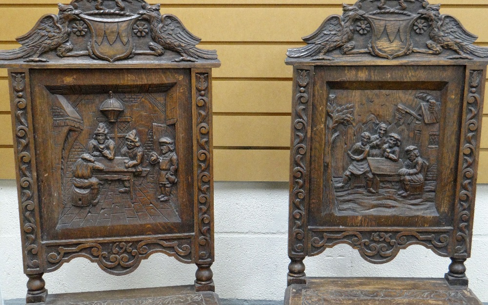 A PAIR OF CARVED OAK TAVERN SCENE CHAIRS with heraldic rails - Image 2 of 3
