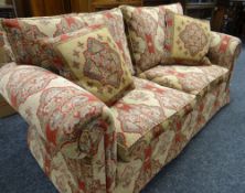 A MODERN TWO-SEATER FLORAL SETTEE to match 108