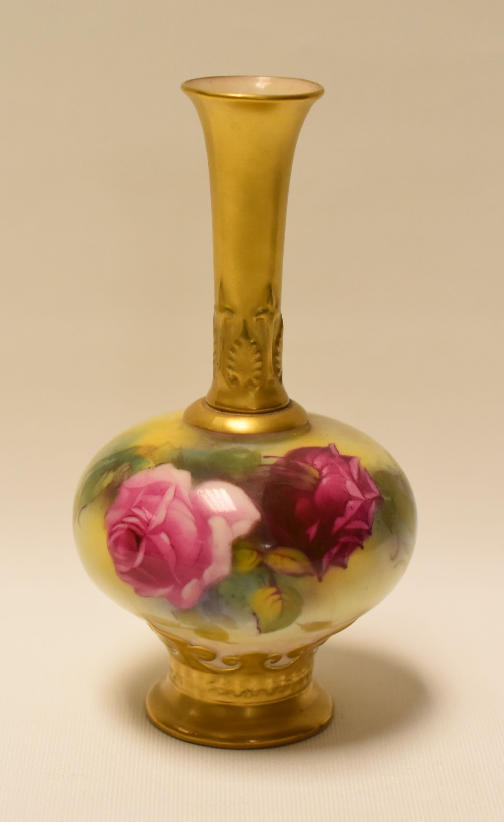 A SMALL ROYAL WORCESTER NARROW NECKED VASE painted with wild roses by Millie Hunt, signed, 14cms