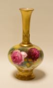 A SMALL ROYAL WORCESTER NARROW NECKED VASE painted with wild roses by Millie Hunt, signed, 14cms