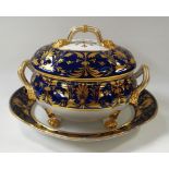 A DERBY PORCELAIN TUREEN & STAND of oval form, the tureen raised on four claw feet and with upturned