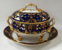 A DERBY PORCELAIN TUREEN & STAND of oval form, the tureen raised on four claw feet and with upturned