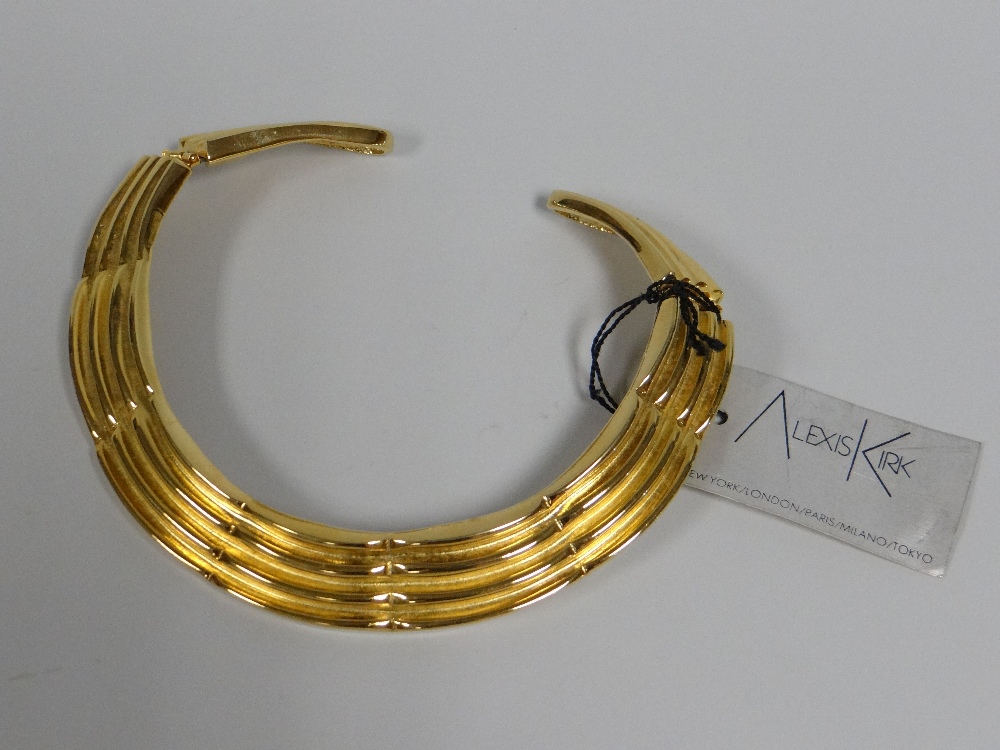 AN ALEXIS KIRK (1936-2010) DESIGNED YELLOW METAL TRIBAL-STYLE HINGING NECKLACE with label