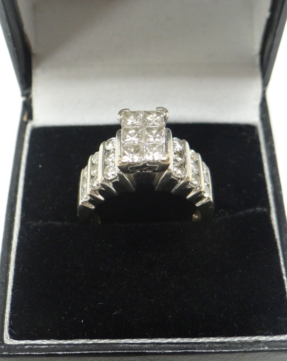 A 14K WHITE GOLD DIAMOND CLUSTER RING with a platform of six diamonds raised above nine diamonds - Image 2 of 2