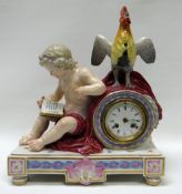 A MEISSEN PORCELAIN MANTEL CLOCK composed of a reading putto seated by a crowing cockerel atop the