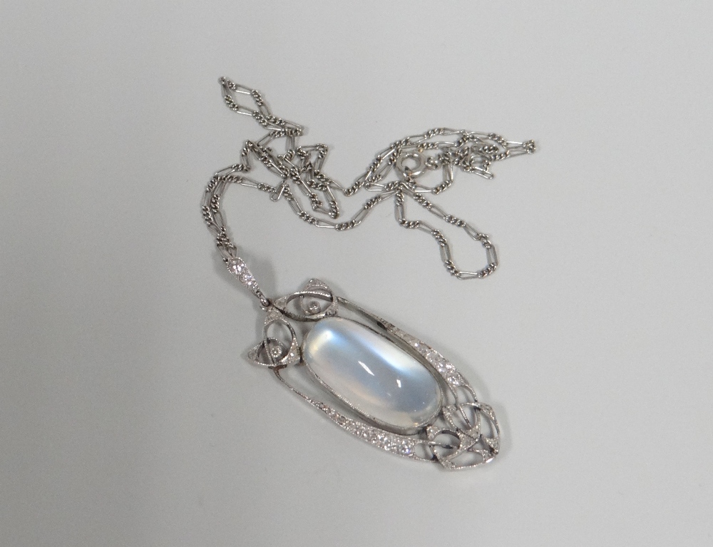 AN ART NOUVEAU MOONSTONE & DIAMOND PENDANT attributed to Archibald Knox (repairs) on a fine necklace