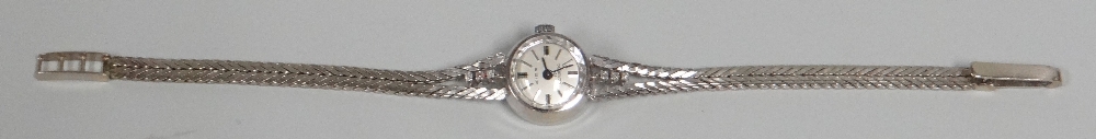 A 14K ZICO INCABLOC WHITE GOLD LADIES WATCH with flat bracelet, 14gms