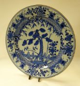 A CHINESE EXPORT BLUE & WHITE CHARGER profusely decorated with forest scene and border of numerous