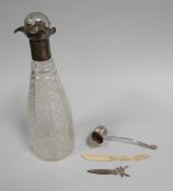 A CUT-GLASS DECANTER WITH SILVER COLLAR, A SILVER SHELL-FORM CASTER SPOON & SILVER BOOKMARK ETC
